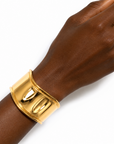 Close up of the Carla Cuff Bangle, a wide polished waterproof gold cuff bracelet.