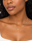 Bajan model wearing the Diamonds By The Yard Necklace in 18K gold-plated sterling silver, featuring delicate bezel-set cubic zirconia stones.