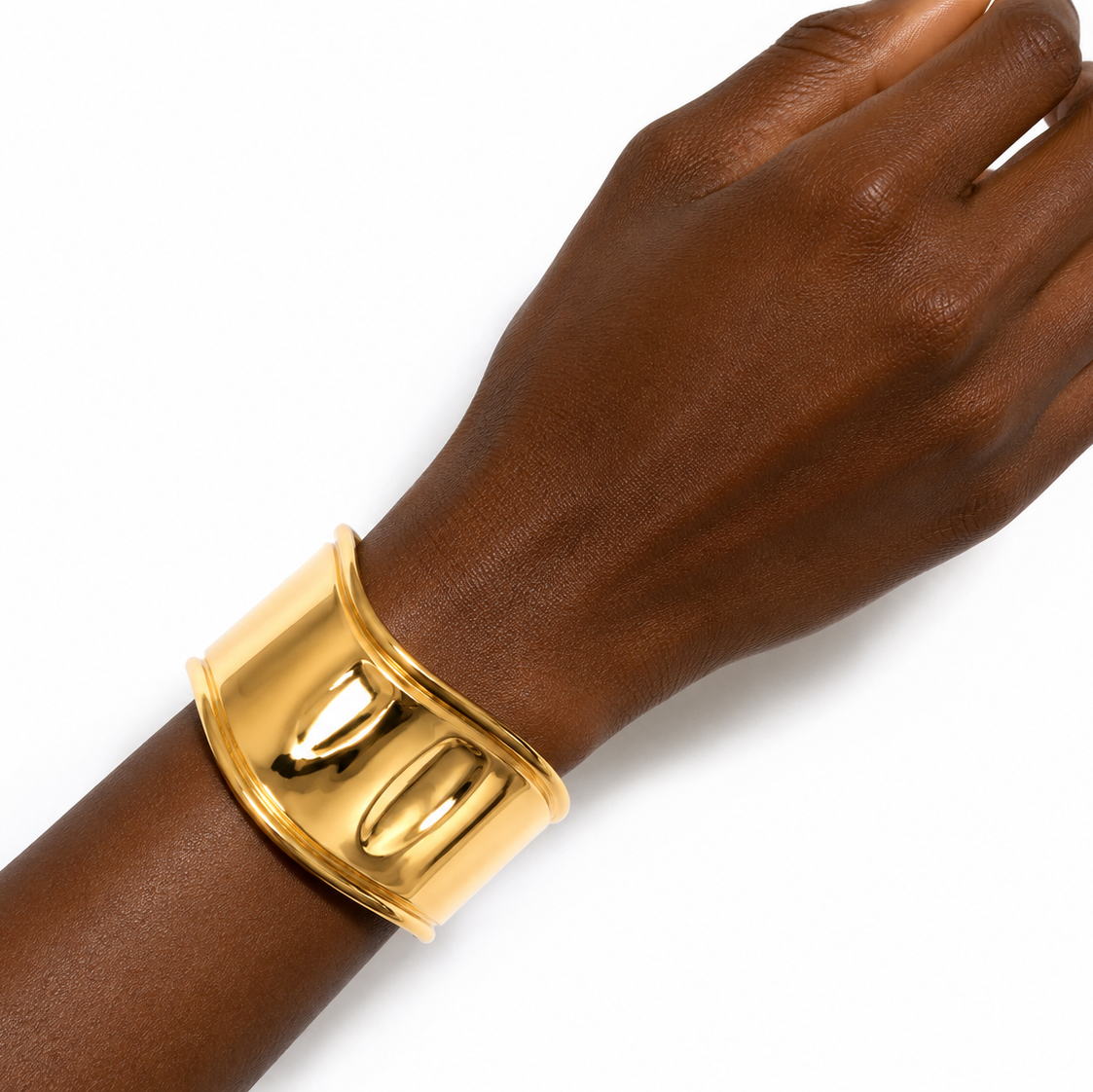 Close up of the Carla Cuff Bangle, a wide polished waterproof gold cuff bracelet.