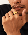 18k gold plated stainless steel signet ring with polished finish on neutral background