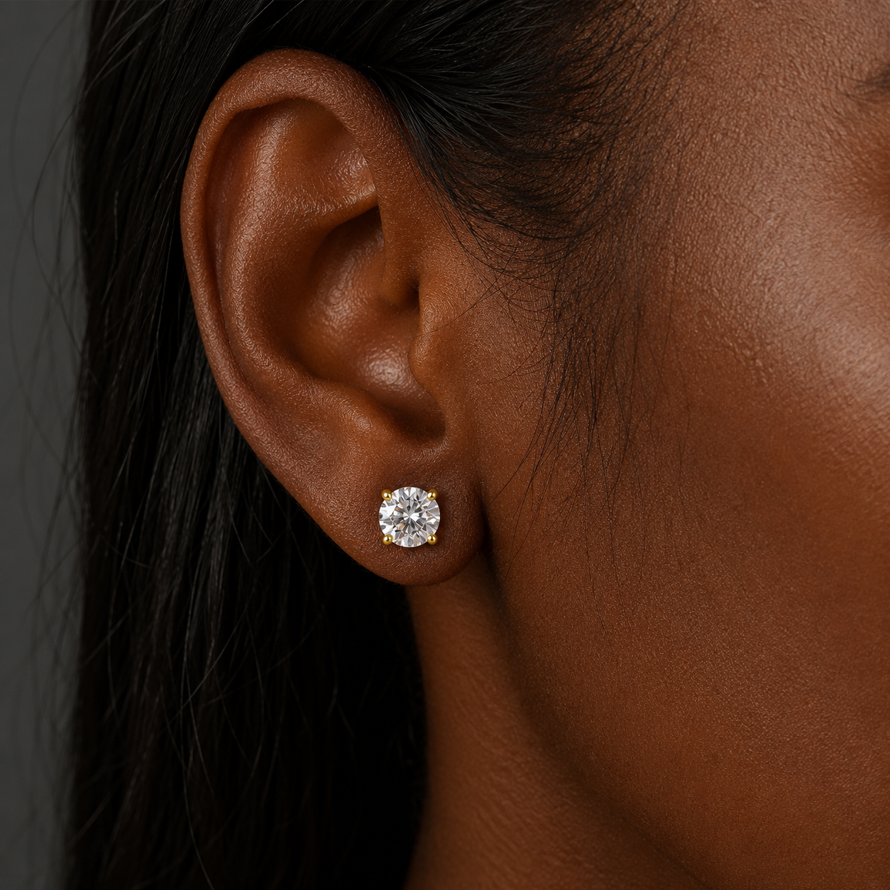 Jumbo Solitaire CZ Studs featuring brilliant 8mm round cubic zirconia in a waterproof gold four prong setting.