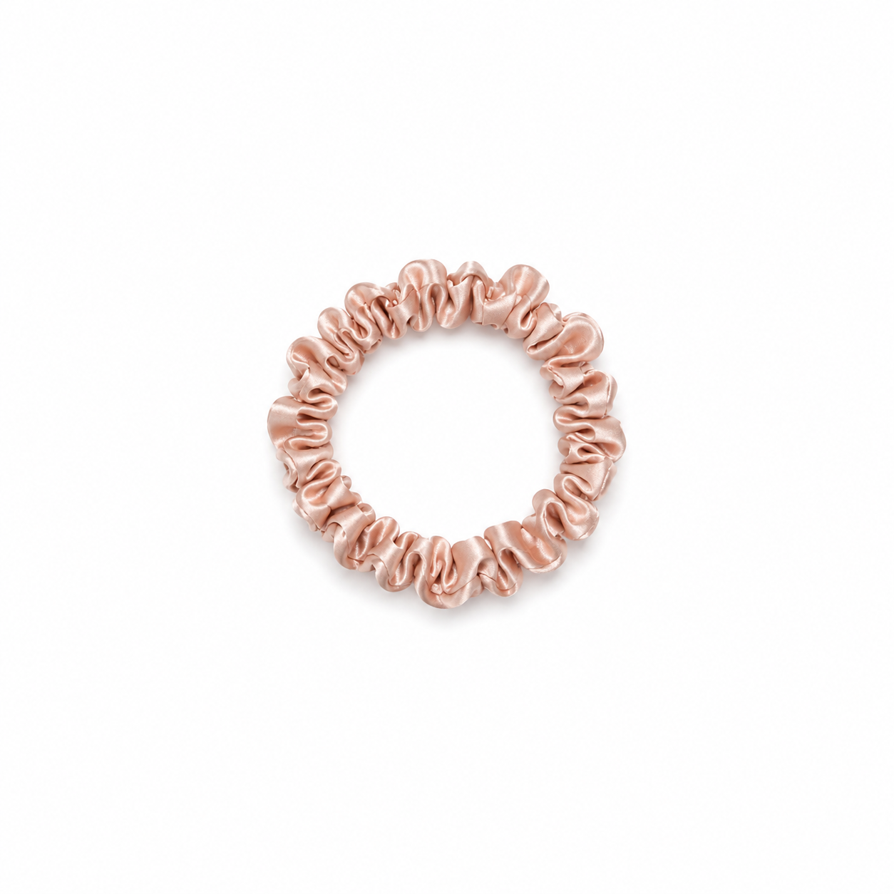 Skinny light pink satin scrunchy hair tie on a clean white background, minimal and lightweight design for everyday use