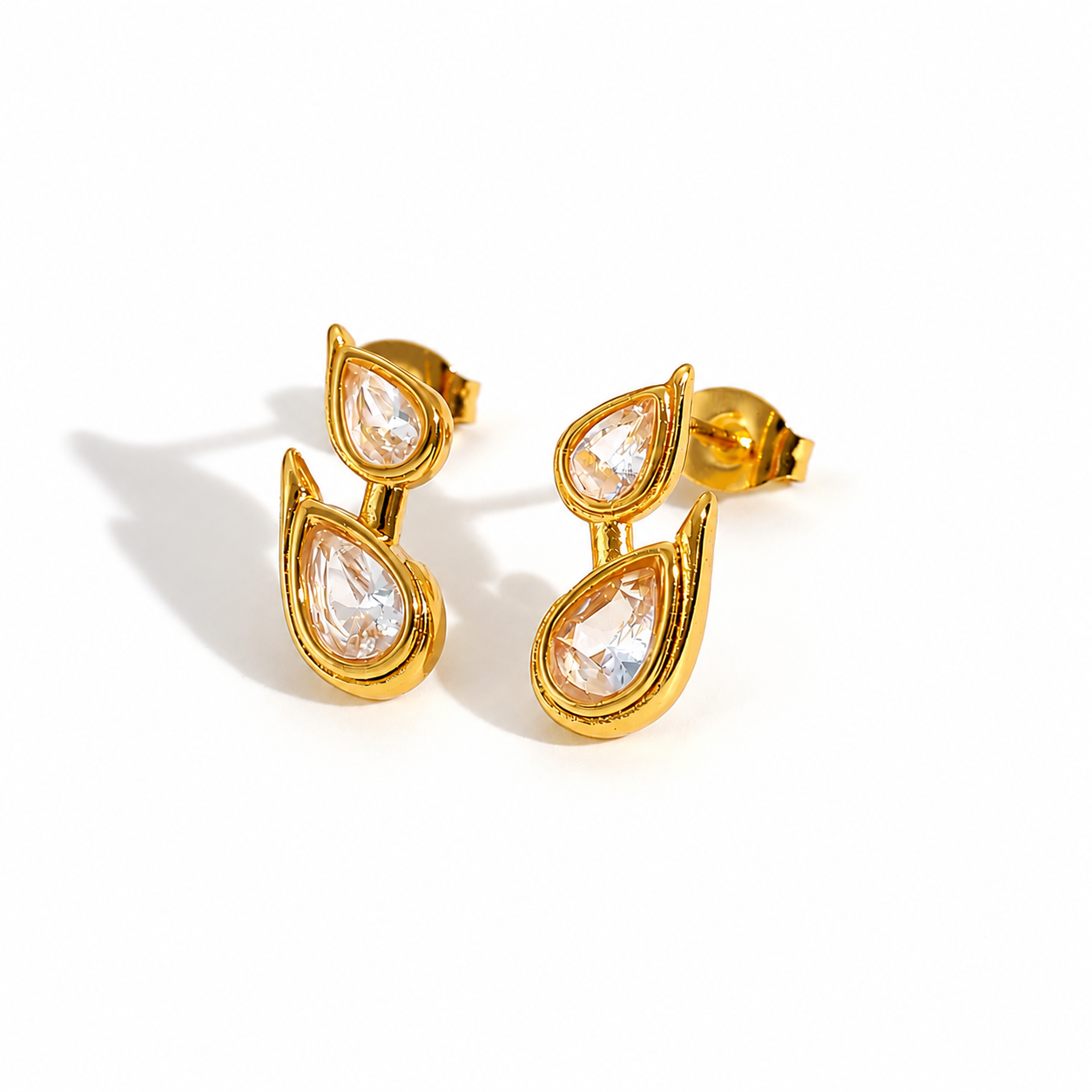 Liora Earrings featuring a waterproof gold double teardrop design with sparkling cubic zirconia.