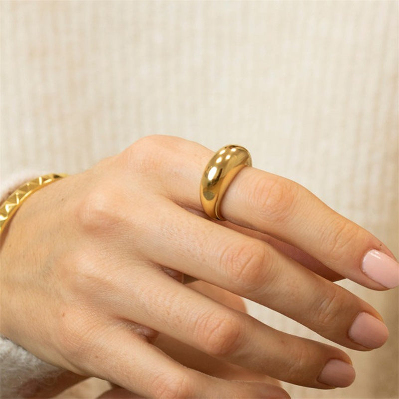 Mini dome ring in 18k gold plated stainless steel with a smooth rounded shape and high polish finish