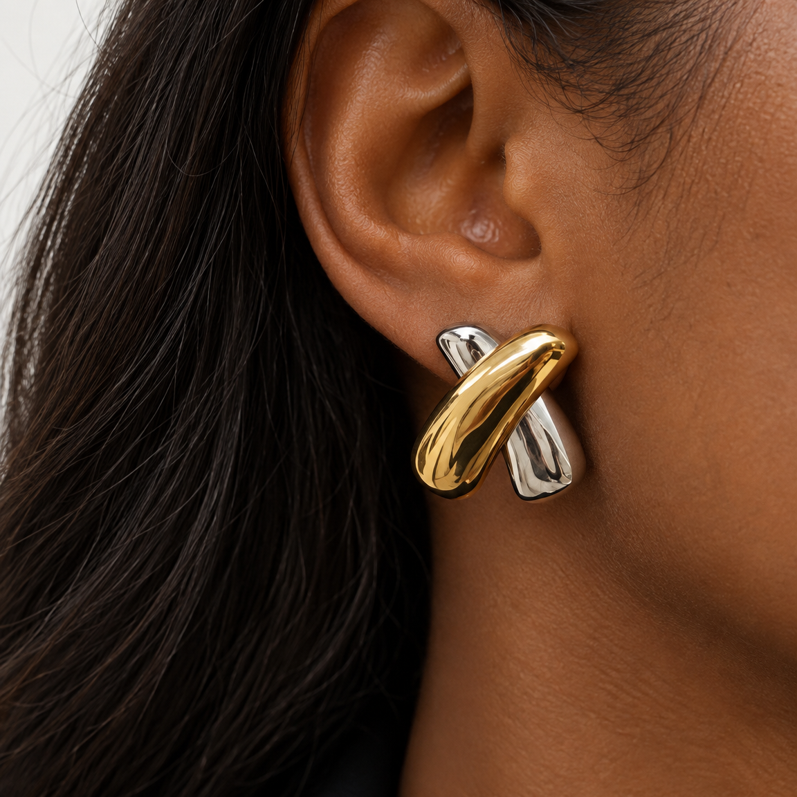 Black woman wearing Paloma Mixed Metal Statement Earrings in 18k gold plated and polished stainless steel
