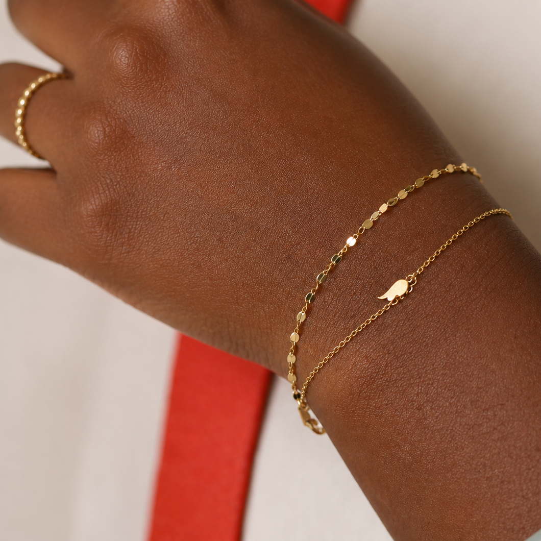 Delicate gold serpentine bracelet in 18k gold plated sterling silver with fine reflective links, minimalist everyday bracelet