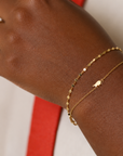 Delicate gold serpentine bracelet in 18k gold plated sterling silver with fine reflective links, minimalist everyday bracelet