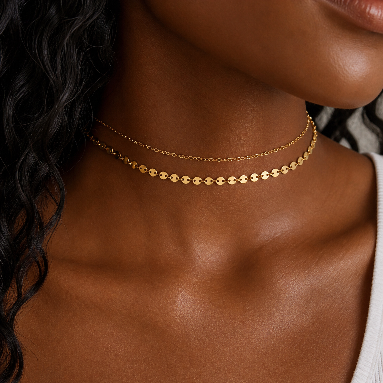 Gold disc necklace in titanium steel with tiny connected discs and cable chain, lightweight layering necklace inspired by Barbados sun