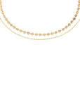 Gold disc necklace in titanium steel with tiny connected discs and cable chain, lightweight layering necklace inspired by Barbados sun