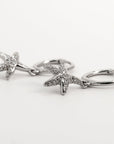 sterling silver star fish huggies with cubic zirconia 