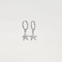 sterling silver star fish huggies wit cubic zirconia