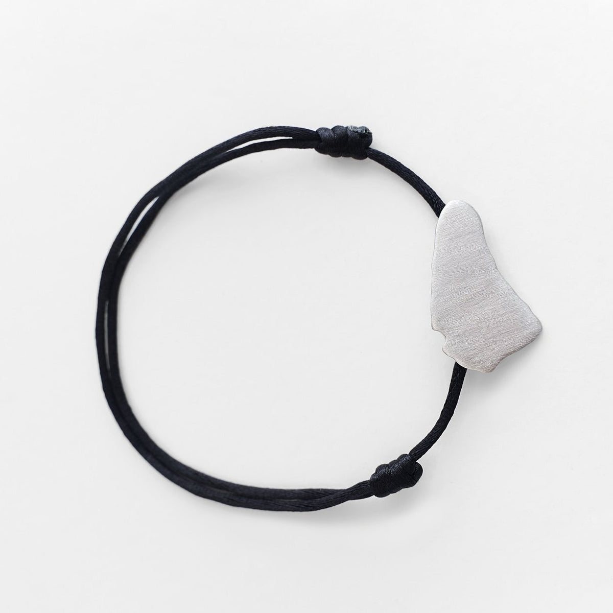 Bim Signature Silver Bracelet with 2mm cord and brushed rhodium-plated sterling silver Barbados map. whatnotz 