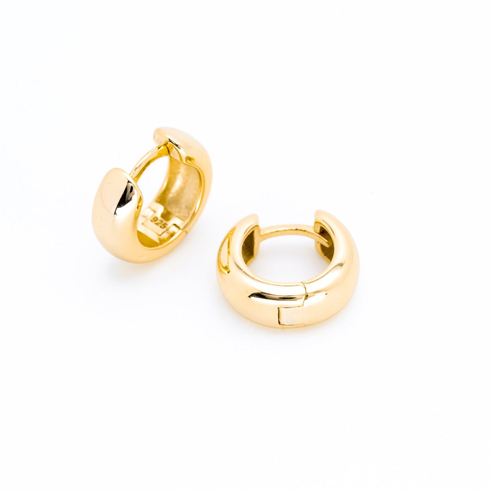 Chunky baby huggie earrings in polished gold plated  with a smooth rounded finish, small hoop design, minimal everyday stackable earrings